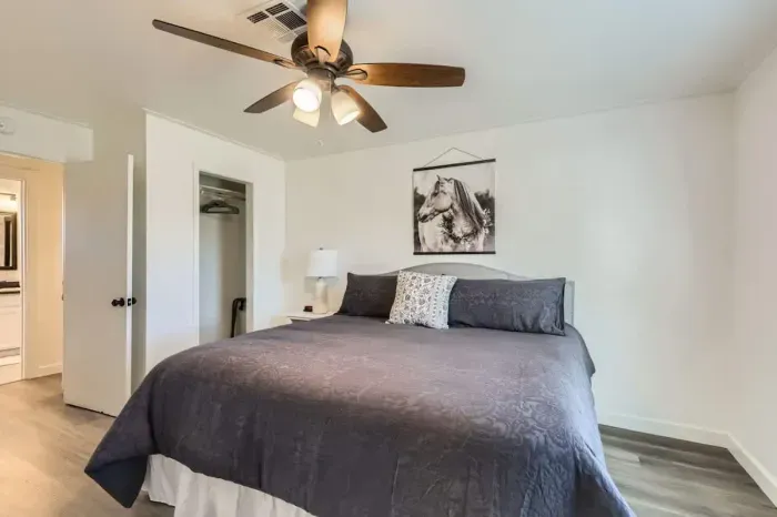 Modern bedroom with minimalist design and high-quality bedding.