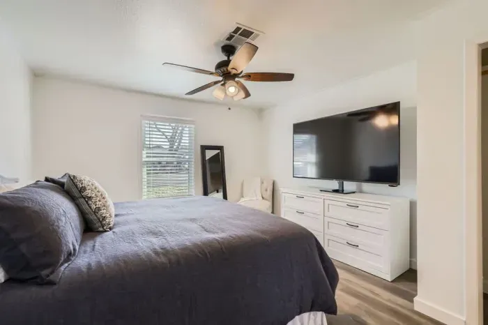 Another angle of the primary bedroom with cozy decor.