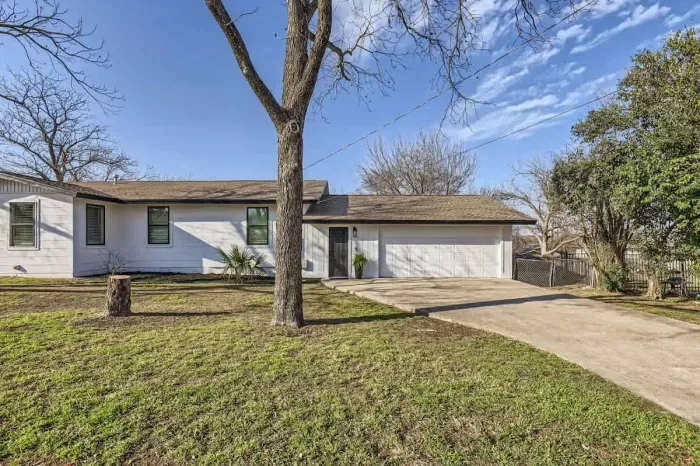Welcoming entrance with charming curb appeal and lush landscaping.