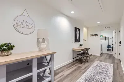 Spacious hallway with a functional desk area, perfect for catching up on work or planning your day.