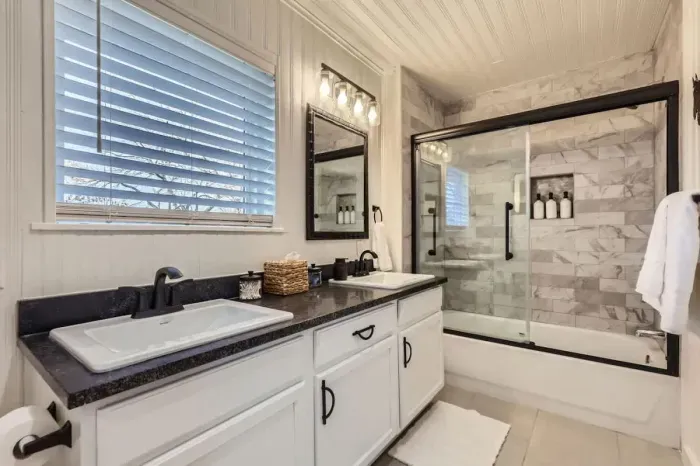 Unwind in our spacious bathroom with modern amenities and a touch of luxury.