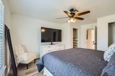 Luxurious bedroom with premium linens and a reading nook for ultimate relaxation.