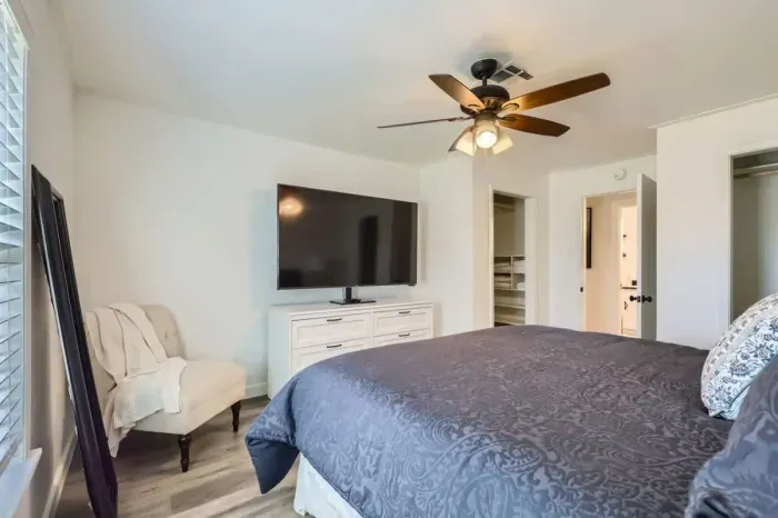 Luxurious bedroom with premium linens and a reading nook for ultimate relaxation.