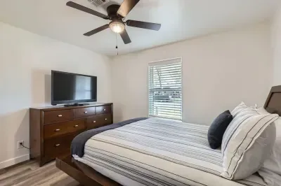 Modern bedroom with minimalist design and high-quality bedding.
