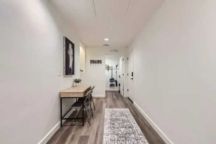 Spacious hallway with a functional desk area, perfect for catching up on work or planning your day.