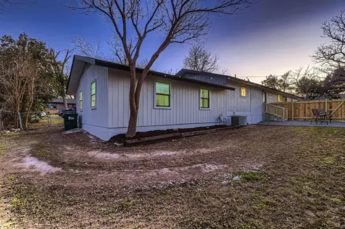 Another view of the backyard with greenery and room to relax.