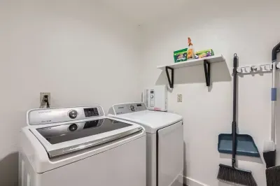 Convenient laundry area with a washer and dryer, making packing a breeze.