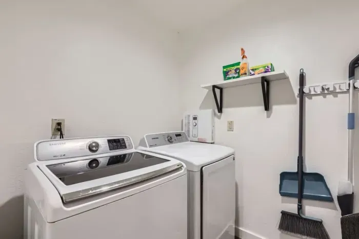 Convenient laundry area with a washer and dryer, making packing a breeze.