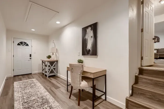 Bright hallway with workspace and modern décor.