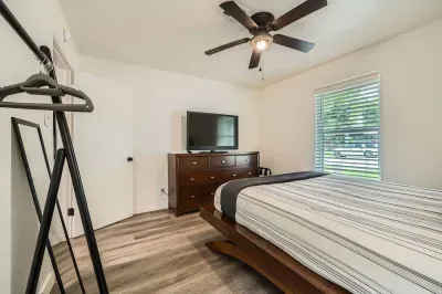 Bedroom with plenty of light and cozy furnishings.