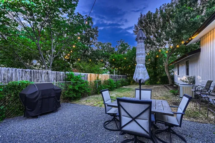 Outdoor dining area in the backyard for enjoying fresh air.