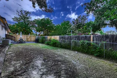 Open backyard space ideal for gatherings and games.