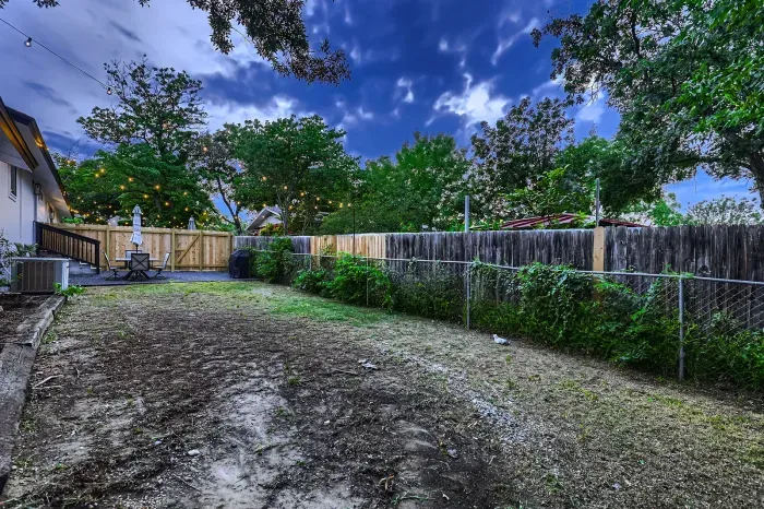 Open backyard space ideal for gatherings and games.