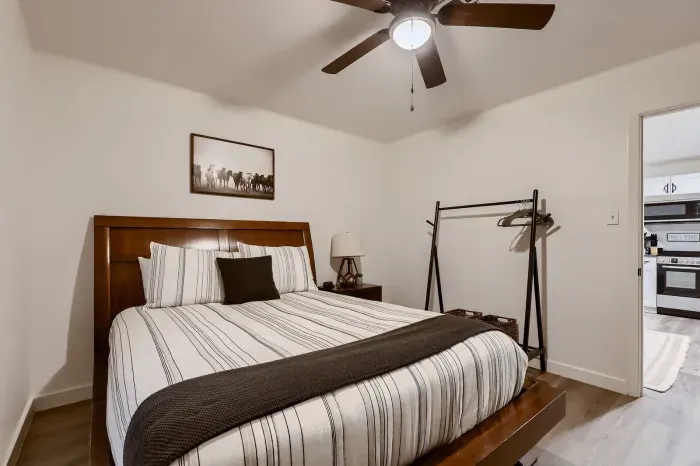 Another inviting bedroom with elegant touches and storage.