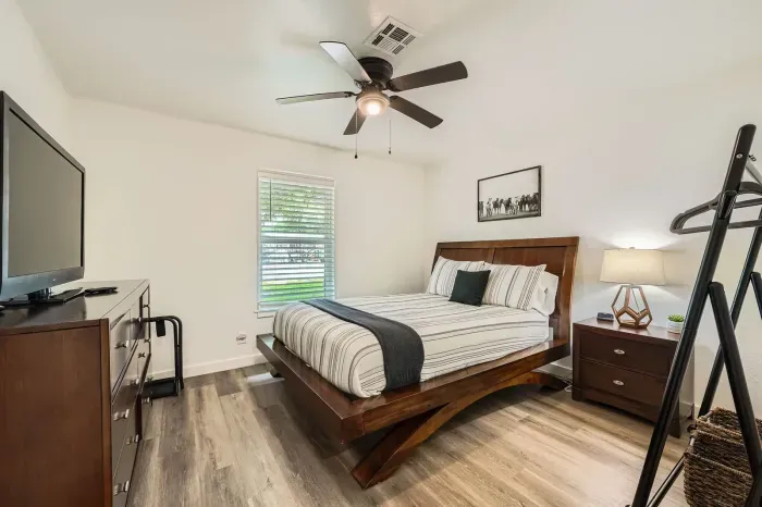 Spacious bedroom with elegant touches and relaxing atmosphere.