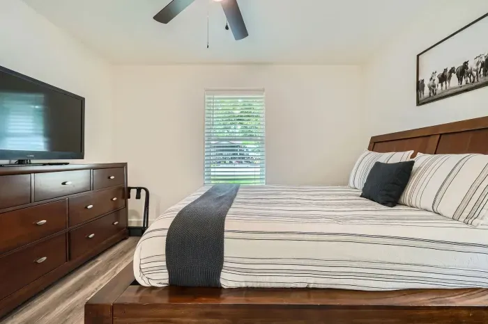 Spacious bedroom with elegant touches and relaxing atmosphere.