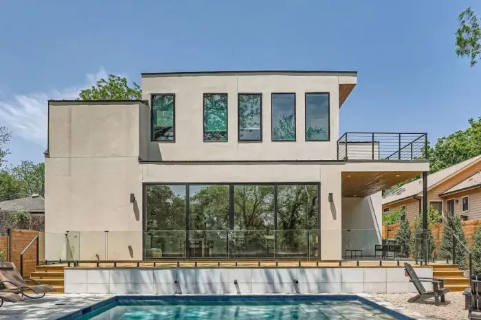 Escape the hustle and bustle in our backyard paradise, where the pool beckons you to relax.