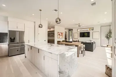 A bright, open-concept kitchen flows seamlessly into the dining area for effortless entertaining.