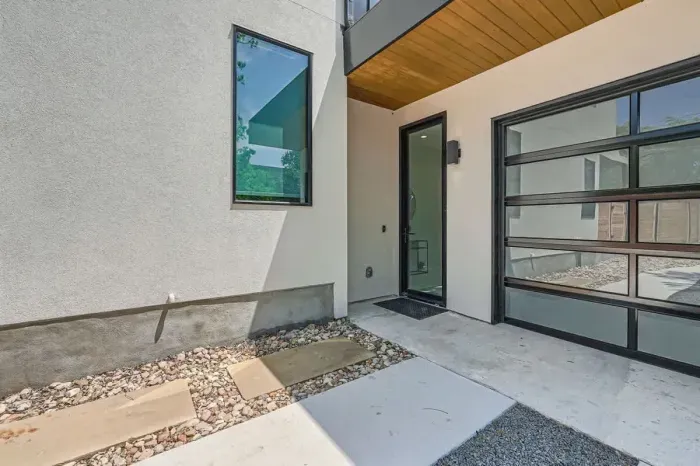 5. Bright and airy exterior with a mix of modern materials and natural finishes.