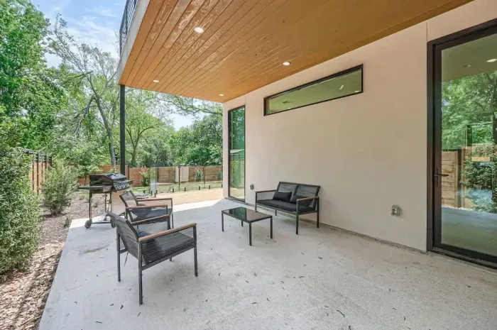 A private patio tucked away in the backyard offers a peaceful space to read, relax, or enjoy a quiet moment.