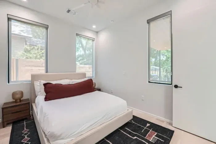 Bright and chic bedroom with plenty of natural light.