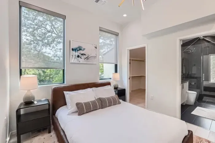 Featuring a plush bed and soothing color palette, this room is a serene escape from the world.