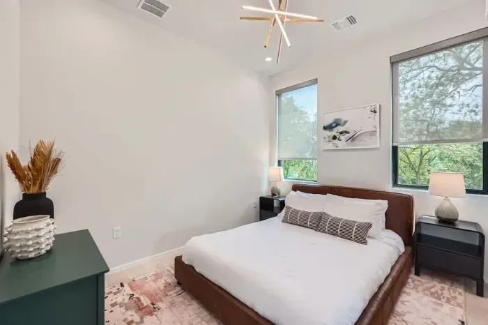 This bedroom features a plush queen bed, soft linens, and calming decor to ensure a restful night’s sleep.