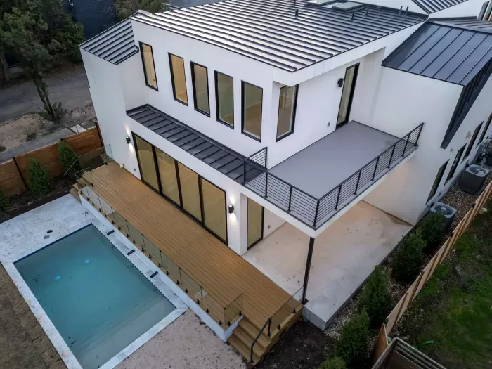 Modern home with sleek lines, large windows, and a minimalist design.