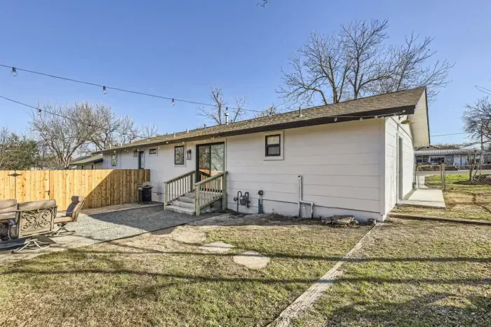 Well-maintained backyard with a variety of trees and shrubs for a natural, private setting.