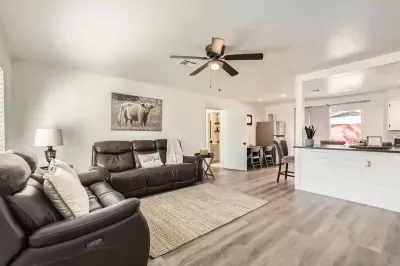 Spacious living area w/ comfortable couches, perfect for gathering with friends and family.