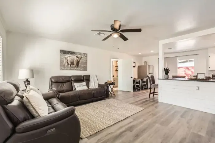 Spacious living area w/ comfortable couches, perfect for gathering with friends and family.