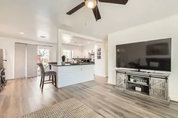 Stylish living room featuring a massive TV and elegant decor.
