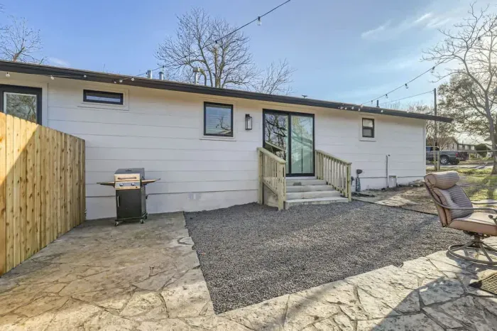 Inviting backyard with a BBQ grill, perfect for entertaining family and friends.
