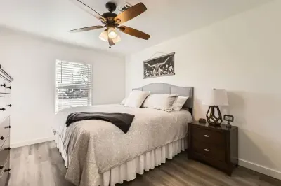 Peaceful bedroom with a plush queen-sized bed and soft linens for a restful night’s sleep.