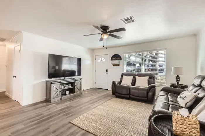 Spacious living area with comfortable couches, perfect for gathering with friends and family.