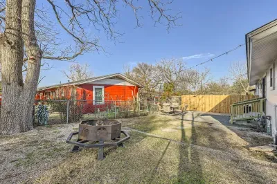 Well-maintained backyard with a variety of trees and shrubs for a natural, private setting.