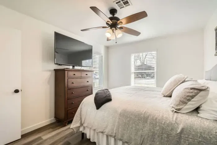 Peaceful bedroom with a plush queen-sized bed and soft linens for a restful night’s sleep.