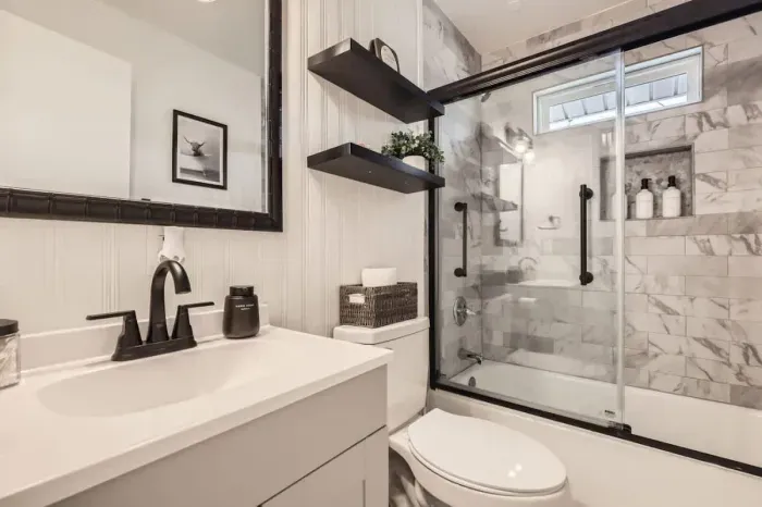Fresh and stylish bathroom with a large vanity and natural light.