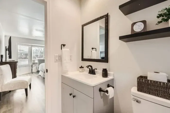 A refreshing, clean bathroom with charming decor and all the essentials.