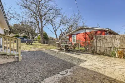 Well-maintained backyard with a variety of trees and shrubs for a natural, private setting.