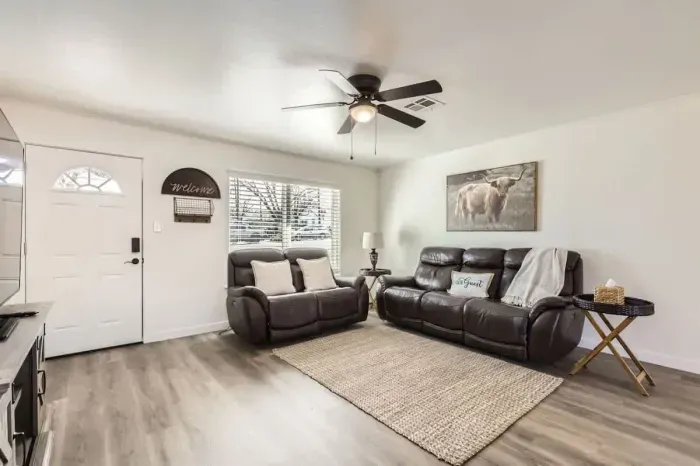 Spacious living area with comfortable couches, perfect for gathering with friends and family.