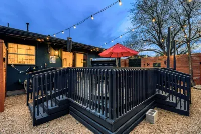 Elevated private deck with string lights and seating, creating a relaxed outdoor space for evenings and gatherings