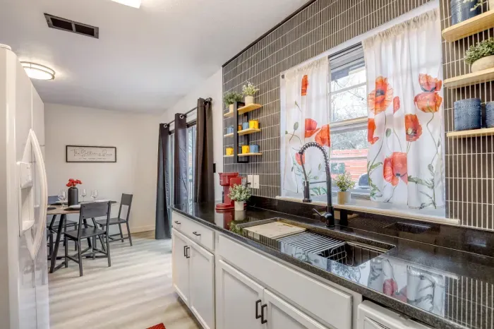 Bright, functional kitchen with ample counter space, natural light, and everything you need for cooking or longer stays