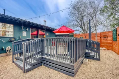 Spacious deck with grill, string lights, and comfortable seating for gathering and enjoying Georgetown evenings