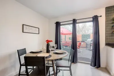 Dining area with seating for four, natural light, and easy access to the backyard patio for indoor-outdoor meals
