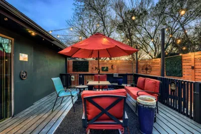 Backyard retreat with grill, string lights, and relaxed seating, perfect for enjoying warm Central Texas nights