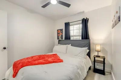 Comfortable bedroom with plush bedding, soft lighting, and a simple layout designed for restful nights