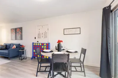 Open dining space connected to the living room, perfect for shared meals, games, or casual gatherings