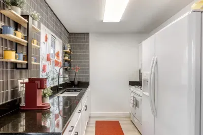 Clean, fully equipped kitchen with sleek finishes and a simple layout that makes cooking feel effortless