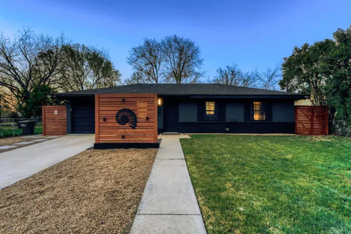 Modern Georgetown home with bold curb appeal, spacious front yard, and private driveway parking